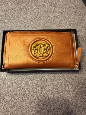 Sharif 1827 Metallic Orange copper Leather wristlet, wallet with gold Emblem